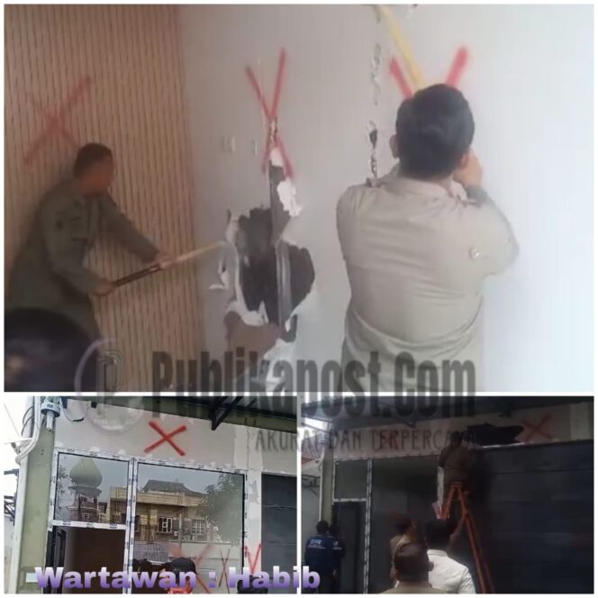 
 Petugas Satpol PP kota Medan Melakukan Ketok Manis di Dinding Gypsum